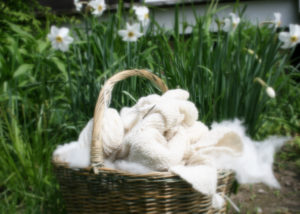 basket of handknit blanket and handspun cashmere yarn